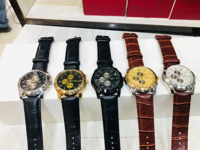 Elegent Watch with genuine leather strap , perfect for both casual and formal for men.