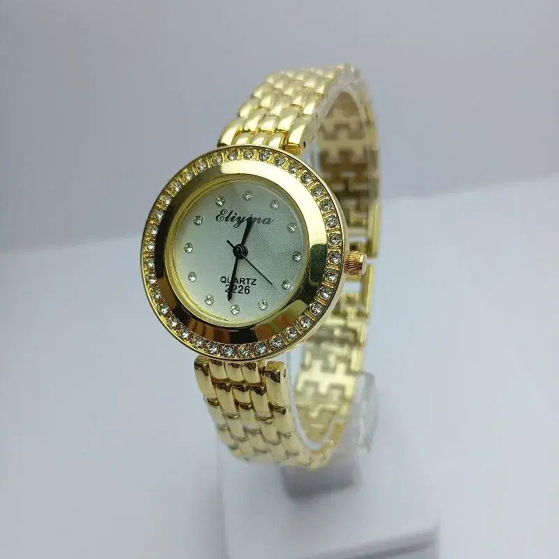 New Design Fashionable Bengal Watch For Women || Eliyina Steel Gold Strap Round White Stone Curved Dial Quartz Movement Waterproof Wrist Watch For Women