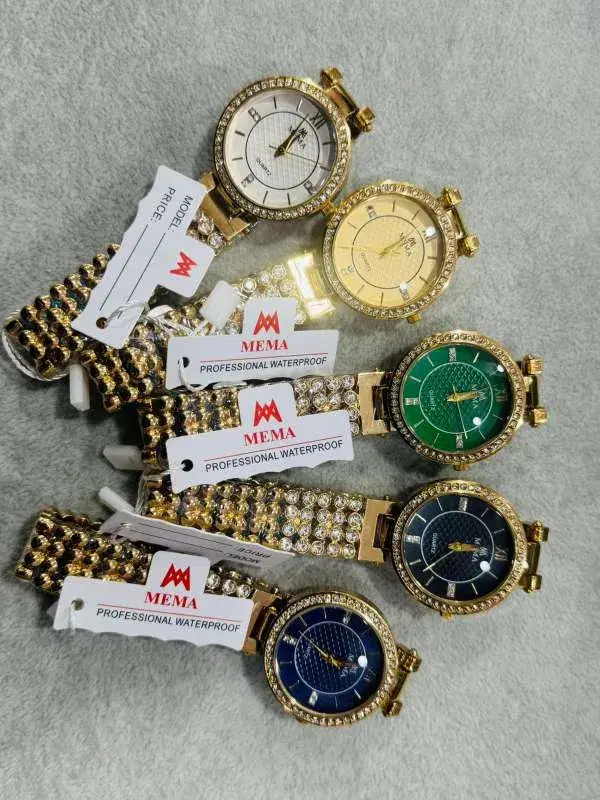 Mema Professional Waterproof Analog women watches with gold-tone metal and rhinestone.