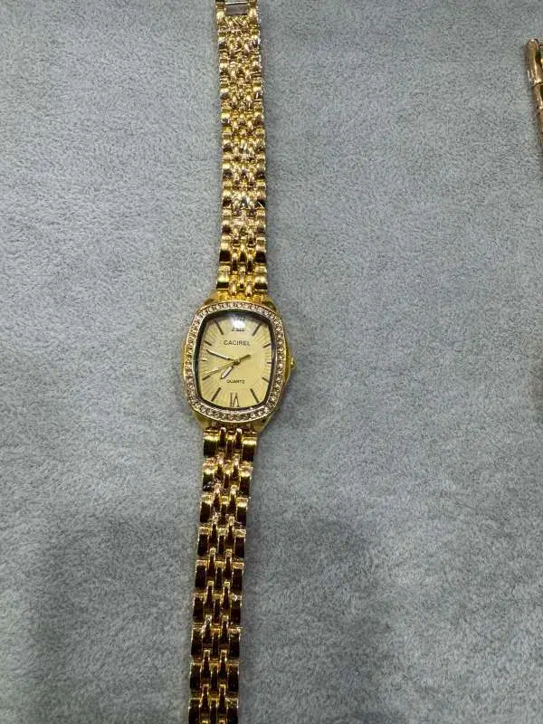 gold tone "cacirel" Quartz women's watch with an embellished rectangular case and a link bracelet