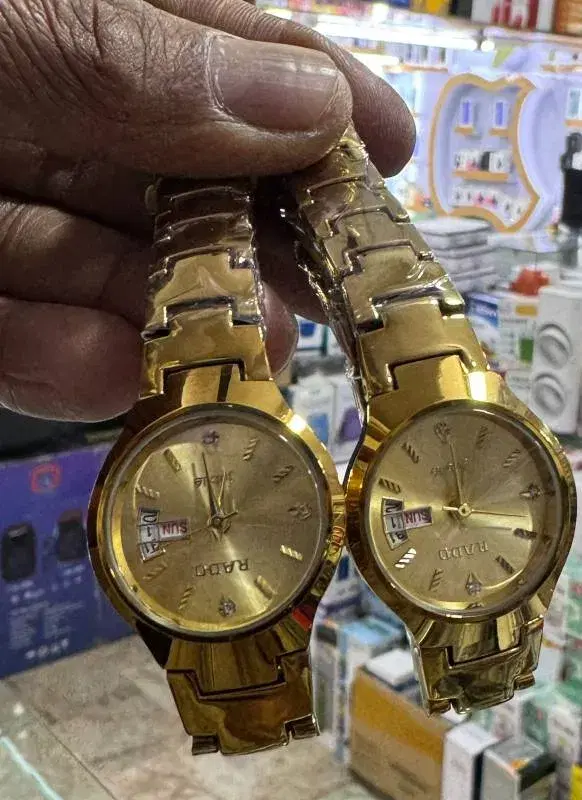 gold-tone "Rado" branded watches