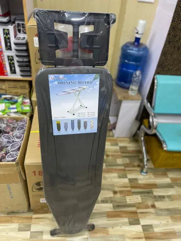 Sheng Lase brand adjustable, foldable ironing board.