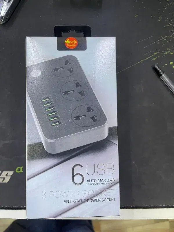 niversal power strip with 3 power sockets and 6 USB charging ports.