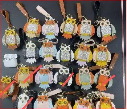 various leather and rhinestone owl keychains or bag charms.