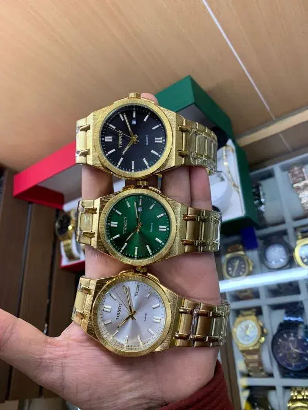 Tissot PRX model in yellow gold PVD coating.