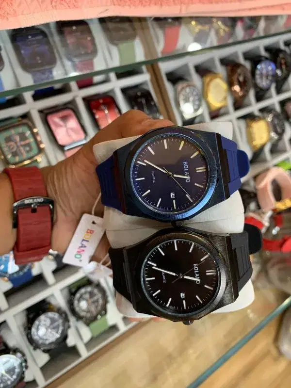 Bolano quartz wristwatches featuring analog displays, rubber straps, and a date calendar function.
