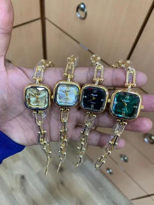 watches feature a square dial and a gold-tone U-shape chain bracelet design.