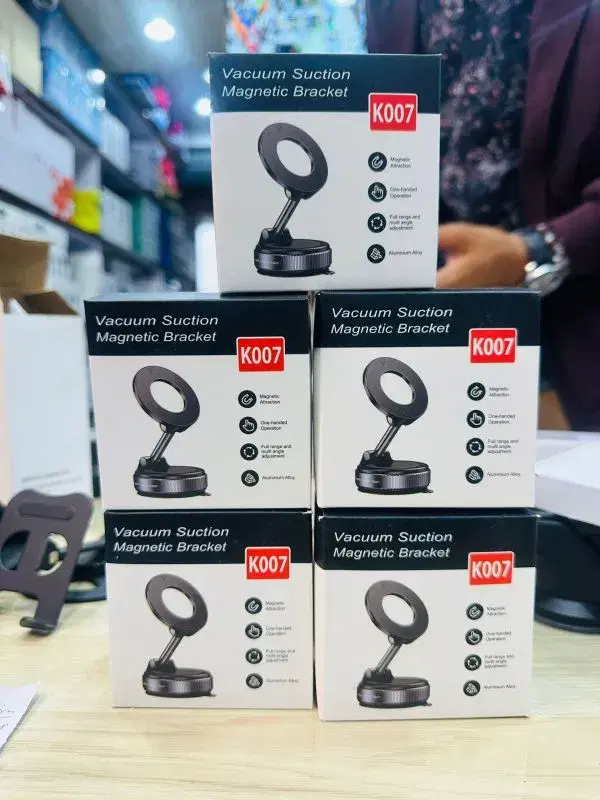 K007 Vacuum Suction Magnetic Bracket used for holding mobile phones in cars or on desks.