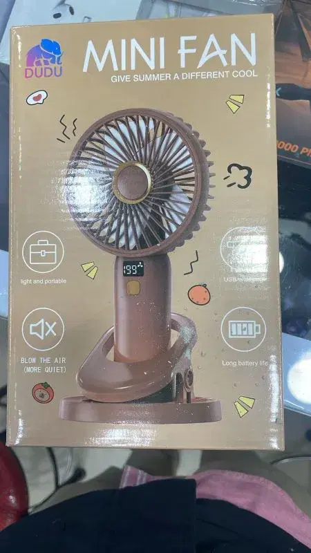 Dudu portable handheld mini fan with a clip base.