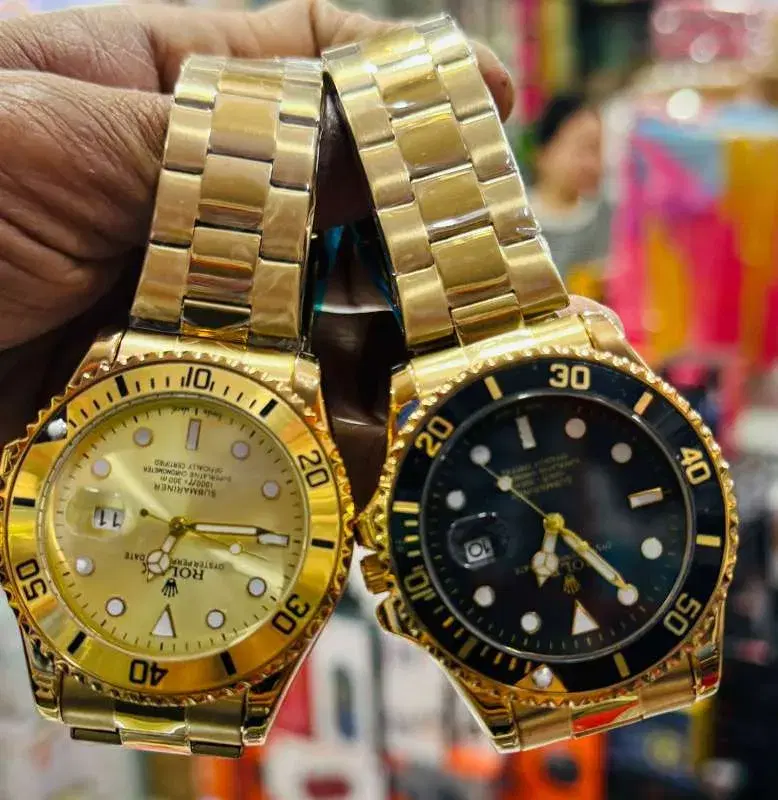 watches featuring gold-toned stainless steel straps and round dials.