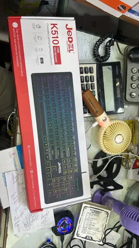 Jedel K510 USB gaming keyboard featuring chocolate-style keys and rainbow lighting.