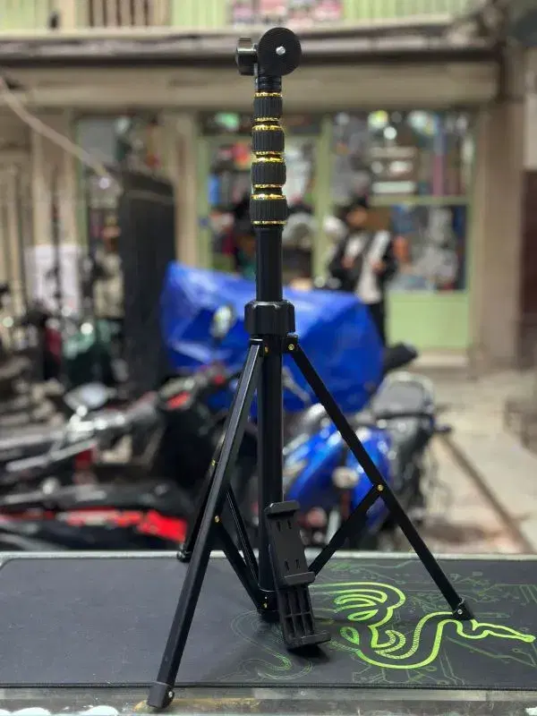 portable tripod stand designed for mobile phones and cameras, often used for vlogging and content creation.