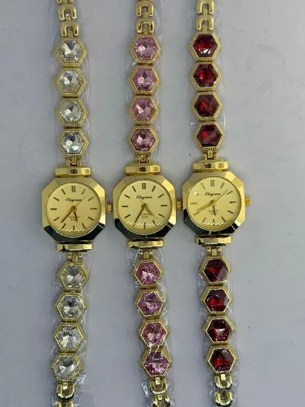 fashion bracelet watch for women featuring hexagon-shaped crystal links in white, pink, and red.