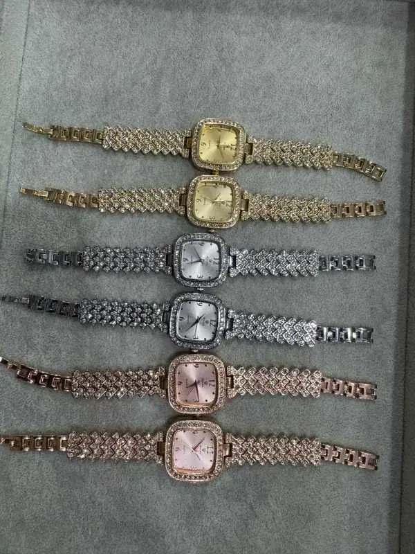 fashion luxury diamond inlaid wristwatch with a square dial and metal strap.