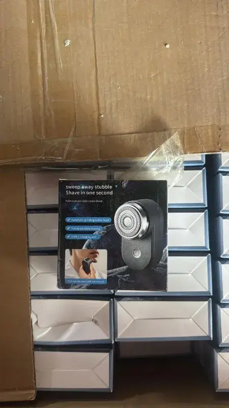 portable electric shaver, commonly marketed for travel or grooming on the go.