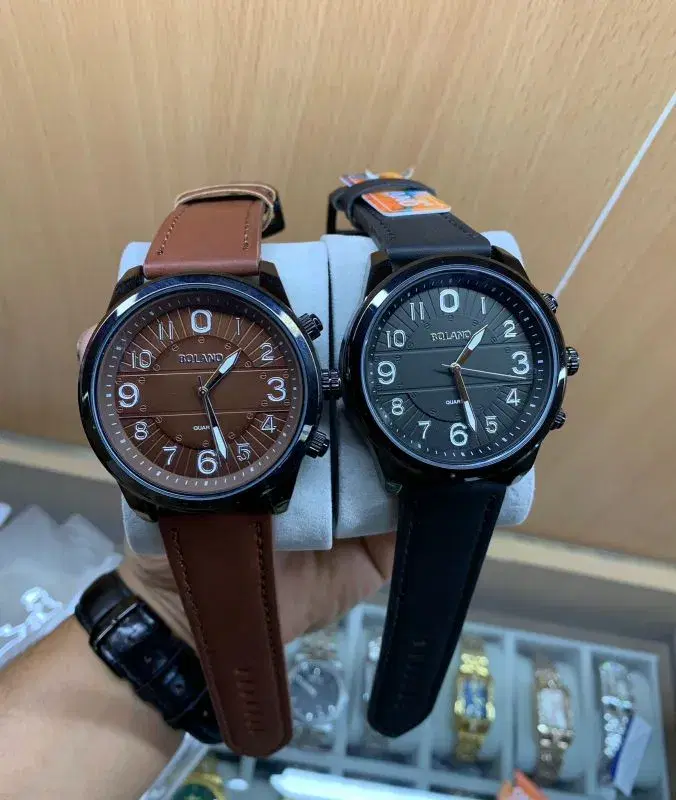 Bolano quartz watches with black and brown leather straps.