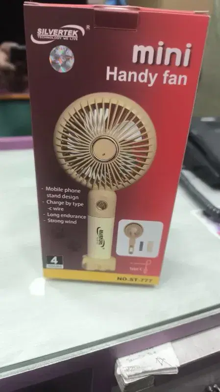 portable mini handy fan featuring a mobile phone stand design and Type-C charging.