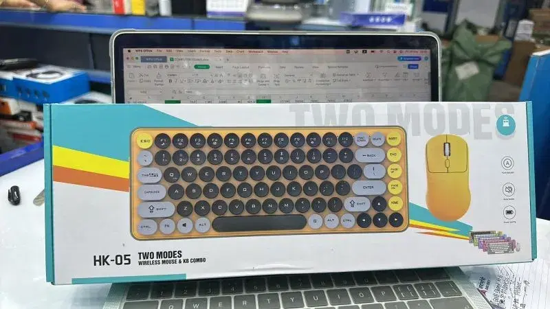 HK-05 wireless combo includes a keyboard featuring a distinctive yellow and grey color scheme with round keycaps.