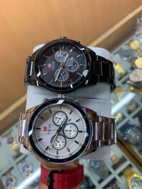 Mini Focus brand, specifically featuring a multifunction chronograph design with a stainless steel band