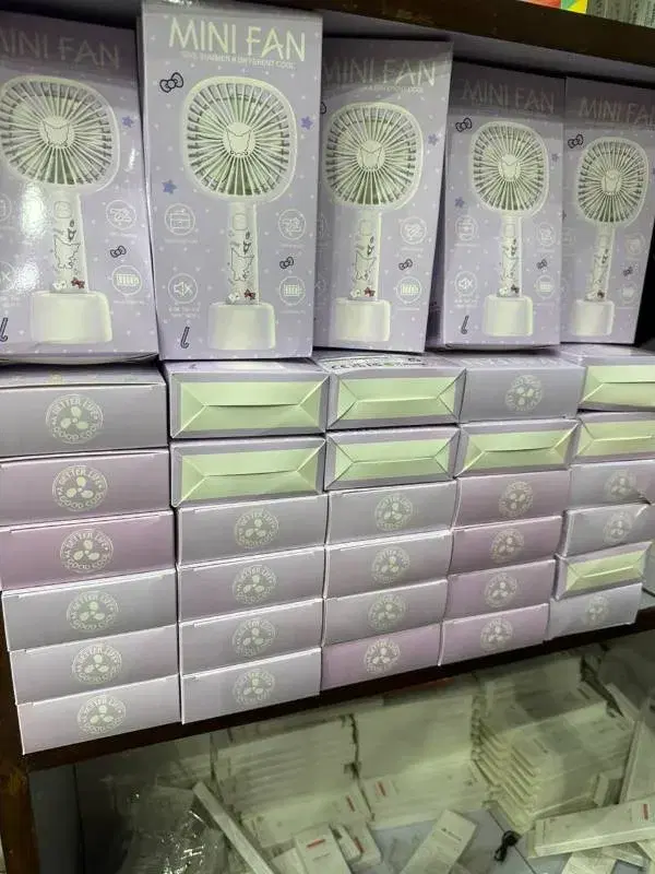 rechargeable mini handheld fans, often marketed as portable cooling devices with stand bases.