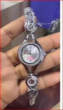 fashionable silver watch for women features a distinctive stoned chain strap and a crystal-accented round dial