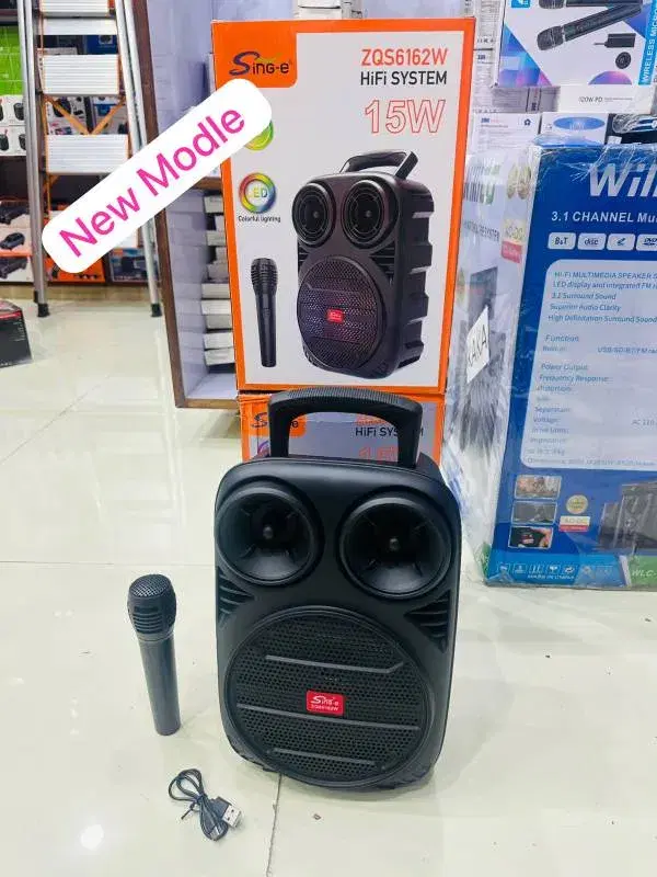 Sing-e ZQS6162W portable Bluetooth speaker featuring a 15W output and a black 6.5-inch woofer design.