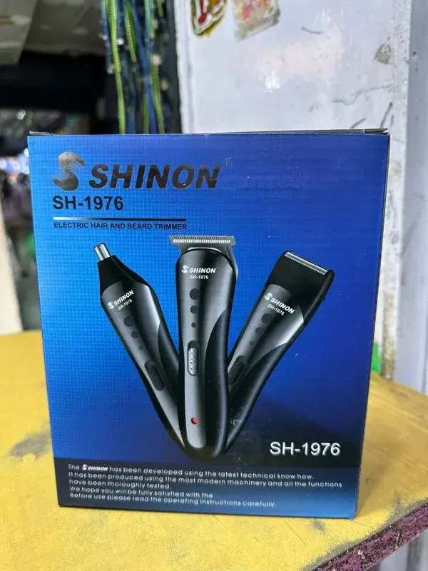 Shinon SH-1976 electric hair and beard trimmer set, which functions as a 3-in-1 grooming kit.
