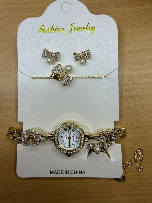 fashion jewelry set includes a gold-toned quartz watch, matching earrings