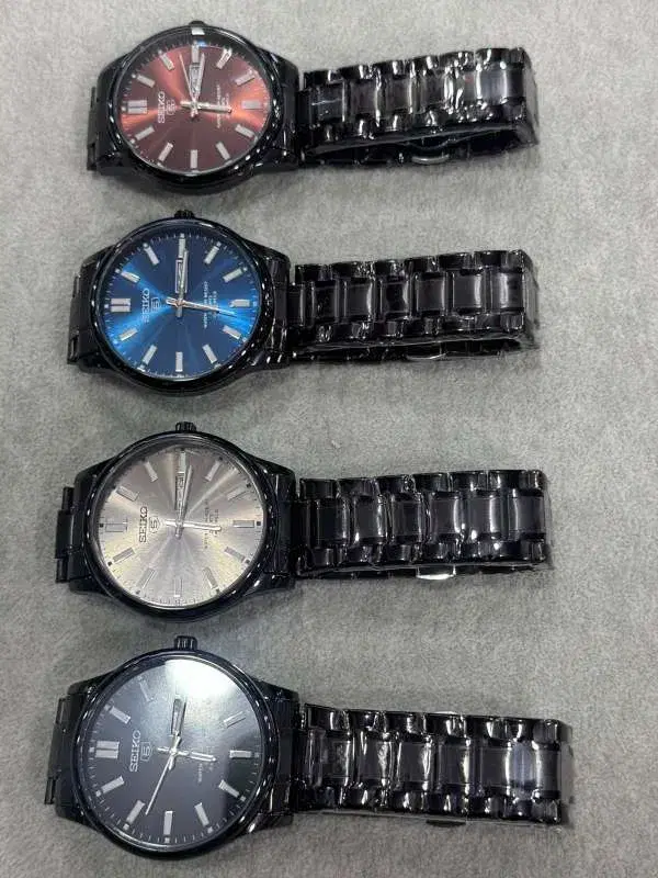 Seiko 5 watches feature a distinct black stainless steel band and case.